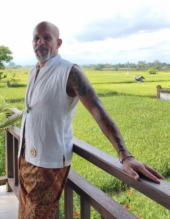 Ángel B wearing a SOICHU ivory vest on a terrace over the rice fields of Amed